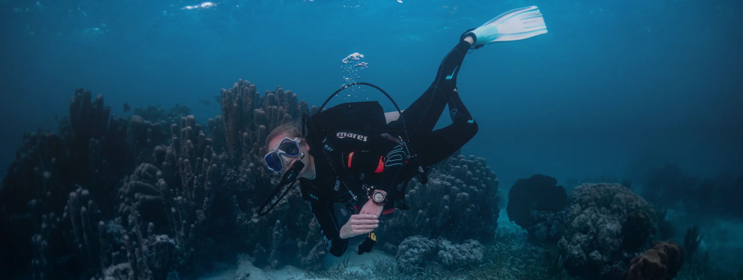 Diver over coral reef